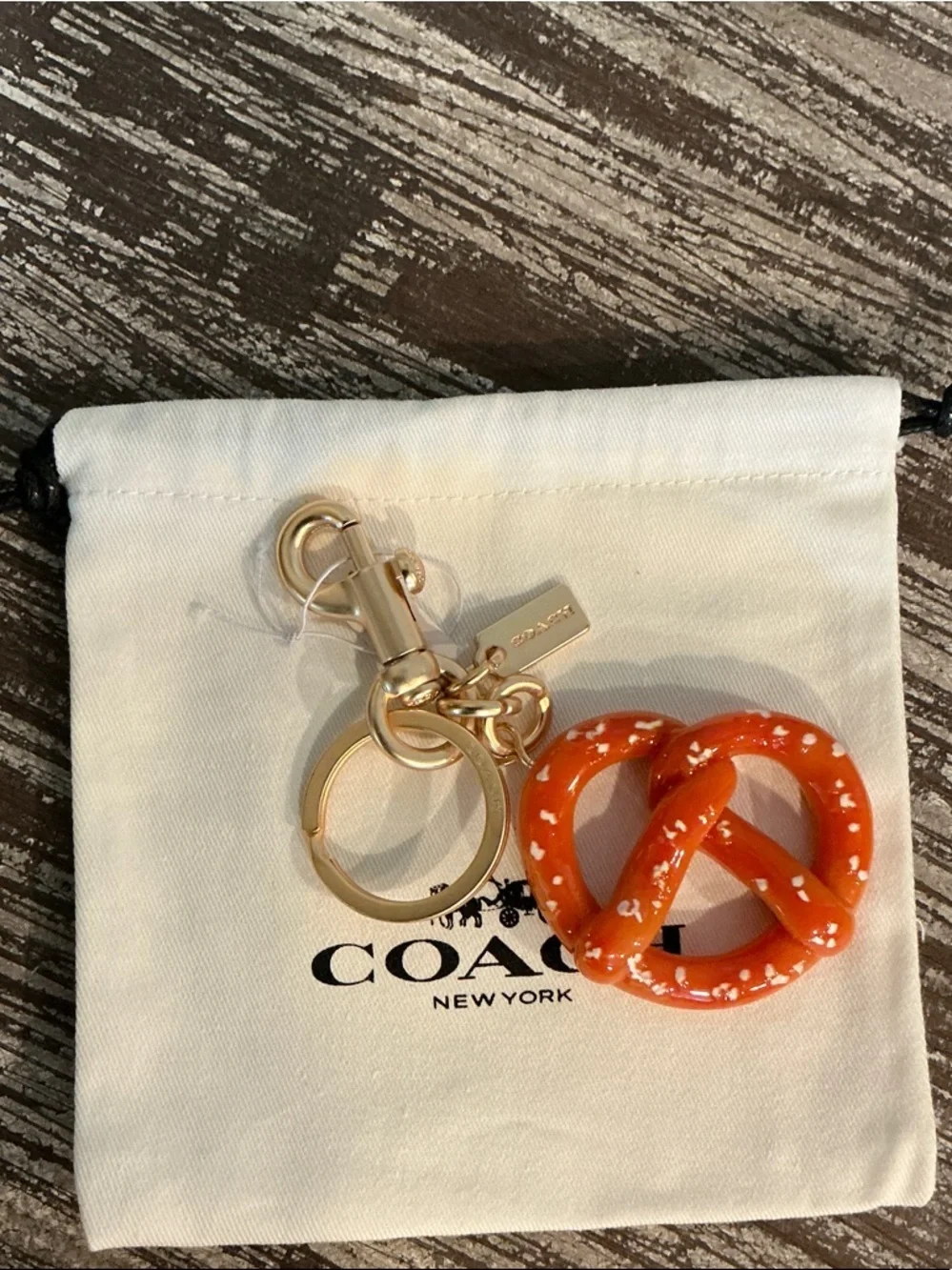 Coach Orange Pretzel Charm Keyring/Bag charm with Gold Hardware. Dusty Included